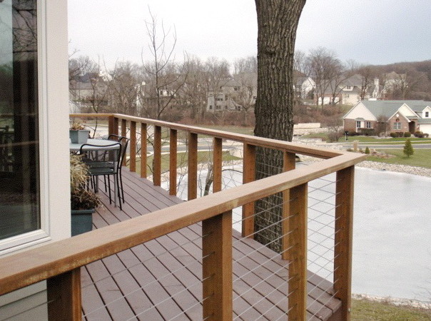 Mid-sized elegant backyard deck photo with no cover