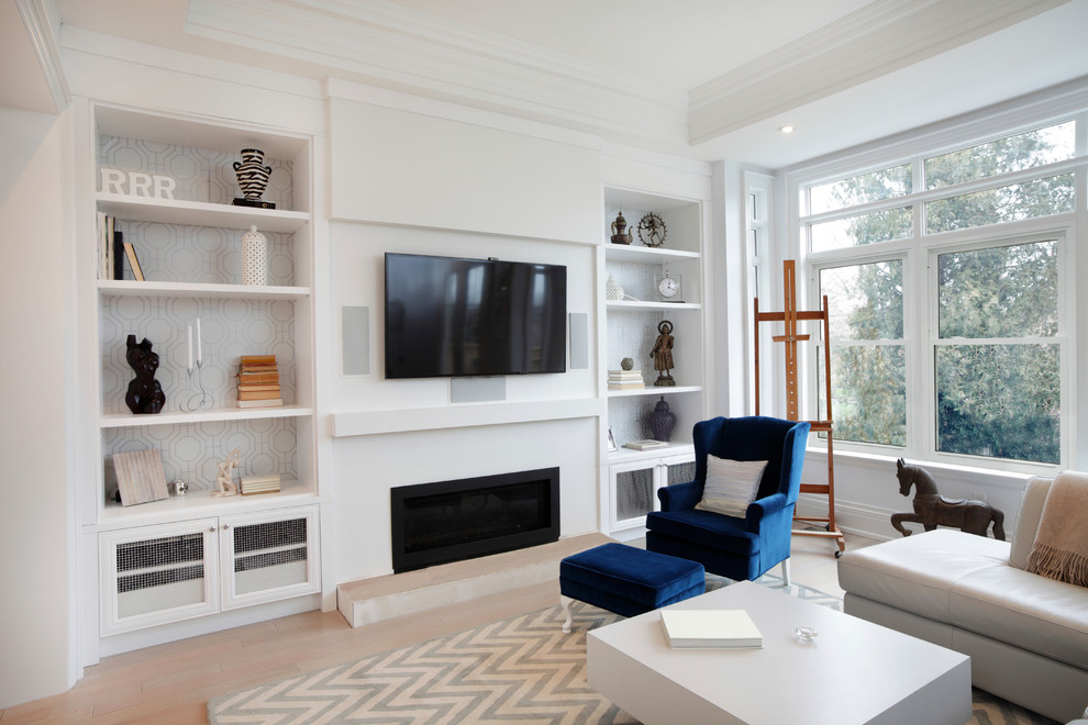 This is an example of a large contemporary formal enclosed living room in Cleveland with white walls, light hardwood floors, a standard fireplace, a plaster fireplace surround, a wall-mounted tv and beige floor.