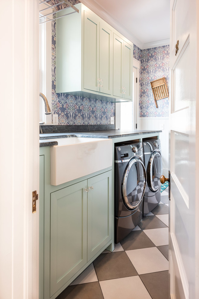 Small eclectic galley dedicated laundry room in San Luis Obispo with a farmhouse sink, shaker cabinets, turquoise cabinets, multi-coloured walls, porcelain floors, a side-by-side washer and dryer, multi-coloured floor and grey benchtop.