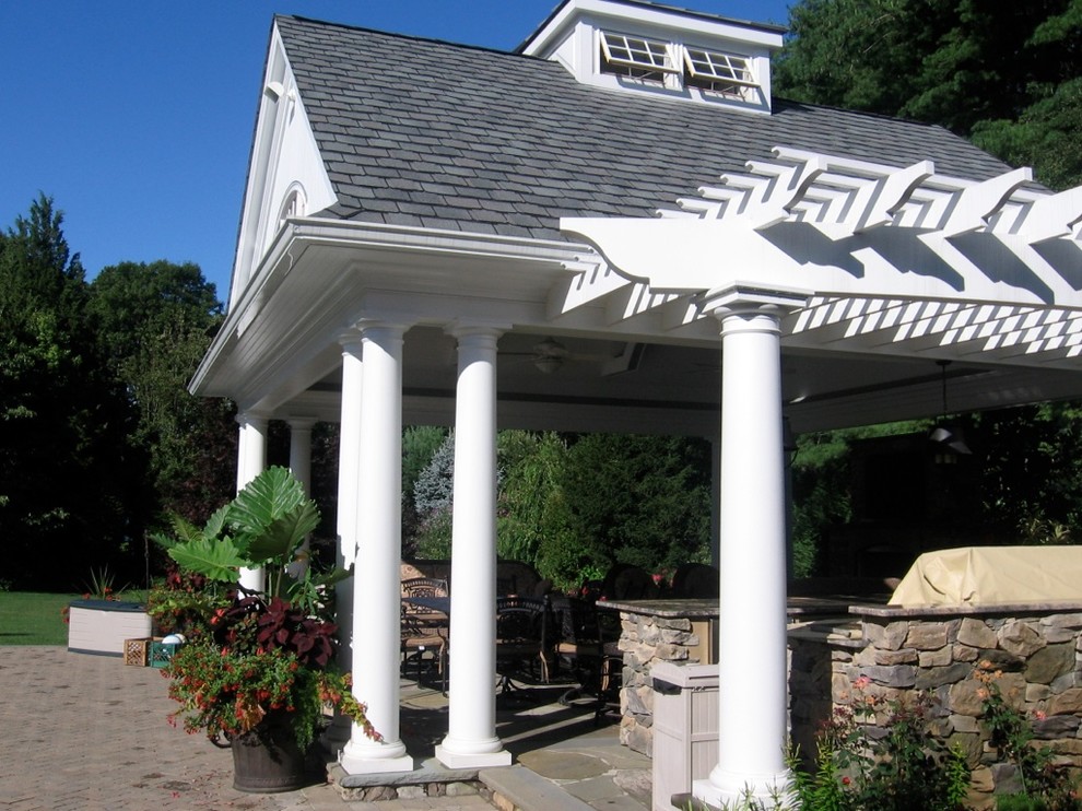 Example of a classic backyard patio design in New York