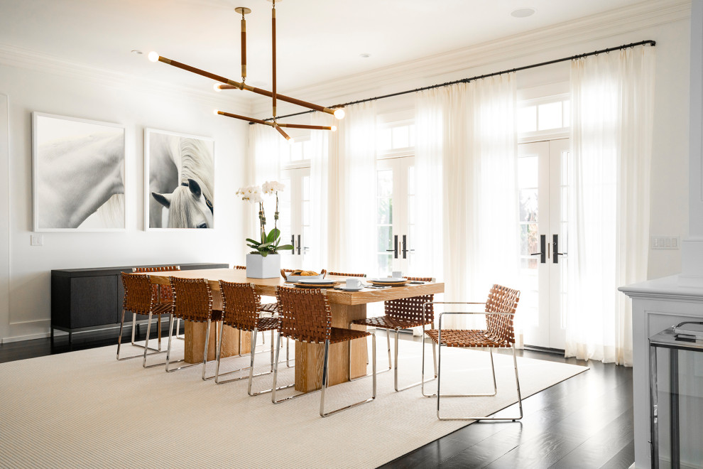 Inspiration for an expansive contemporary open plan dining in New York with white walls, dark hardwood floors and black floor.