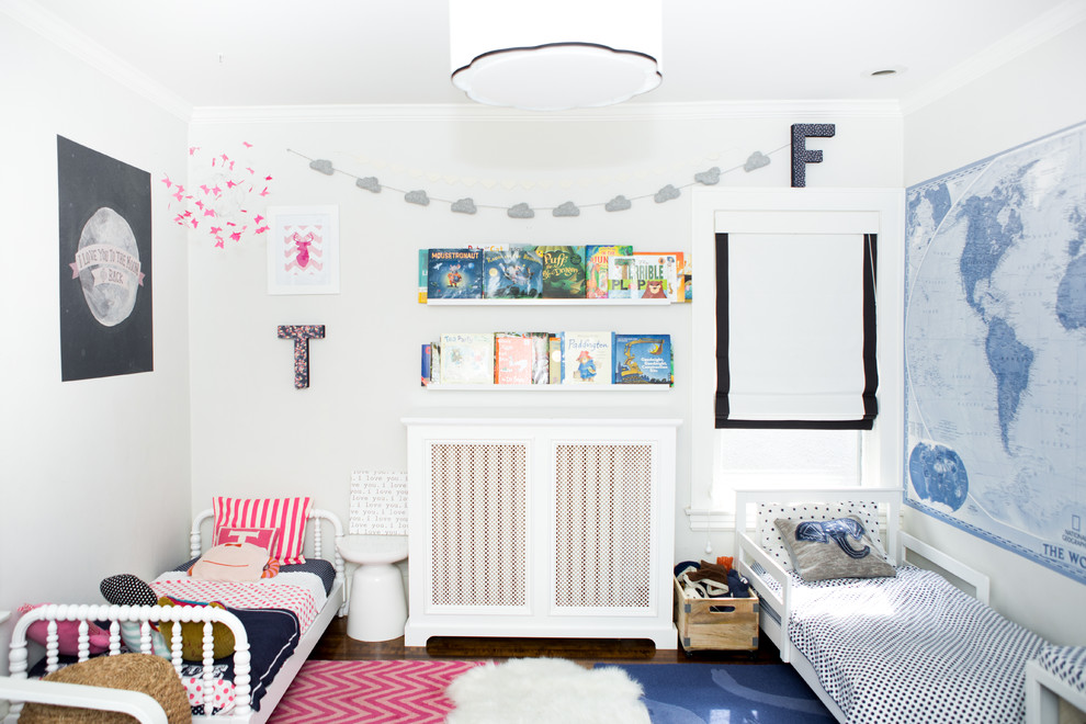 Inspiration for a small transitional gender-neutral kids' bedroom for kids 4-10 years old in Chicago with white walls and dark hardwood floors.