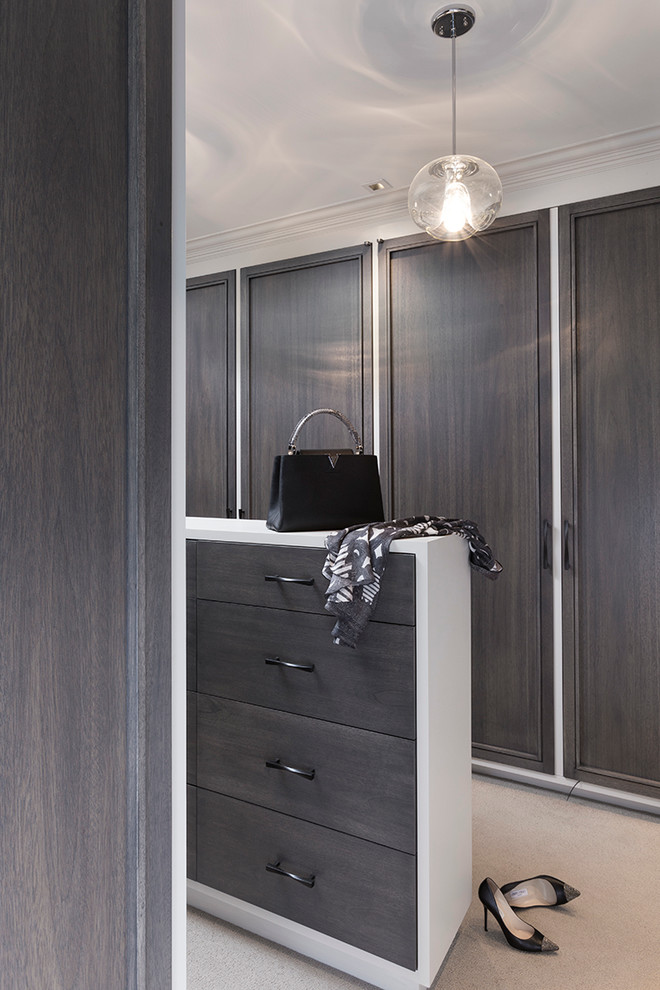 Inspiration for a transitional walk-in wardrobe in San Francisco with flat-panel cabinets, grey cabinets and carpet.