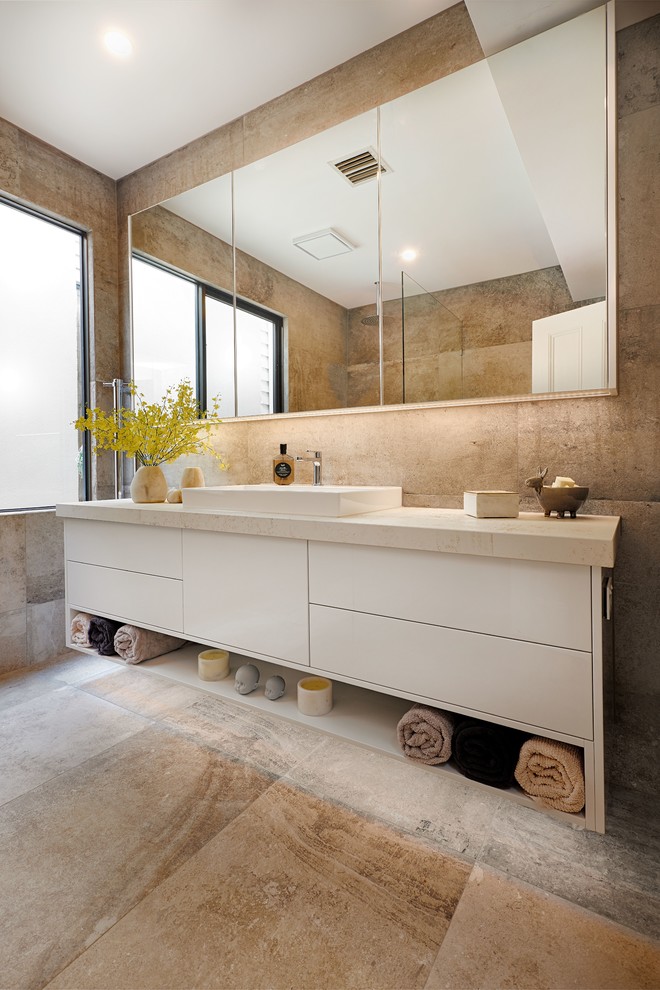 Contemporary bathroom in Melbourne with white cabinets, brown tile, porcelain tile, porcelain floors, solid surface benchtops, brown floor and beige benchtops.