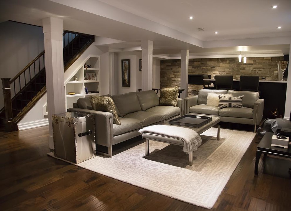 Expansive transitional basement in Toronto with white walls and medium hardwood floors.