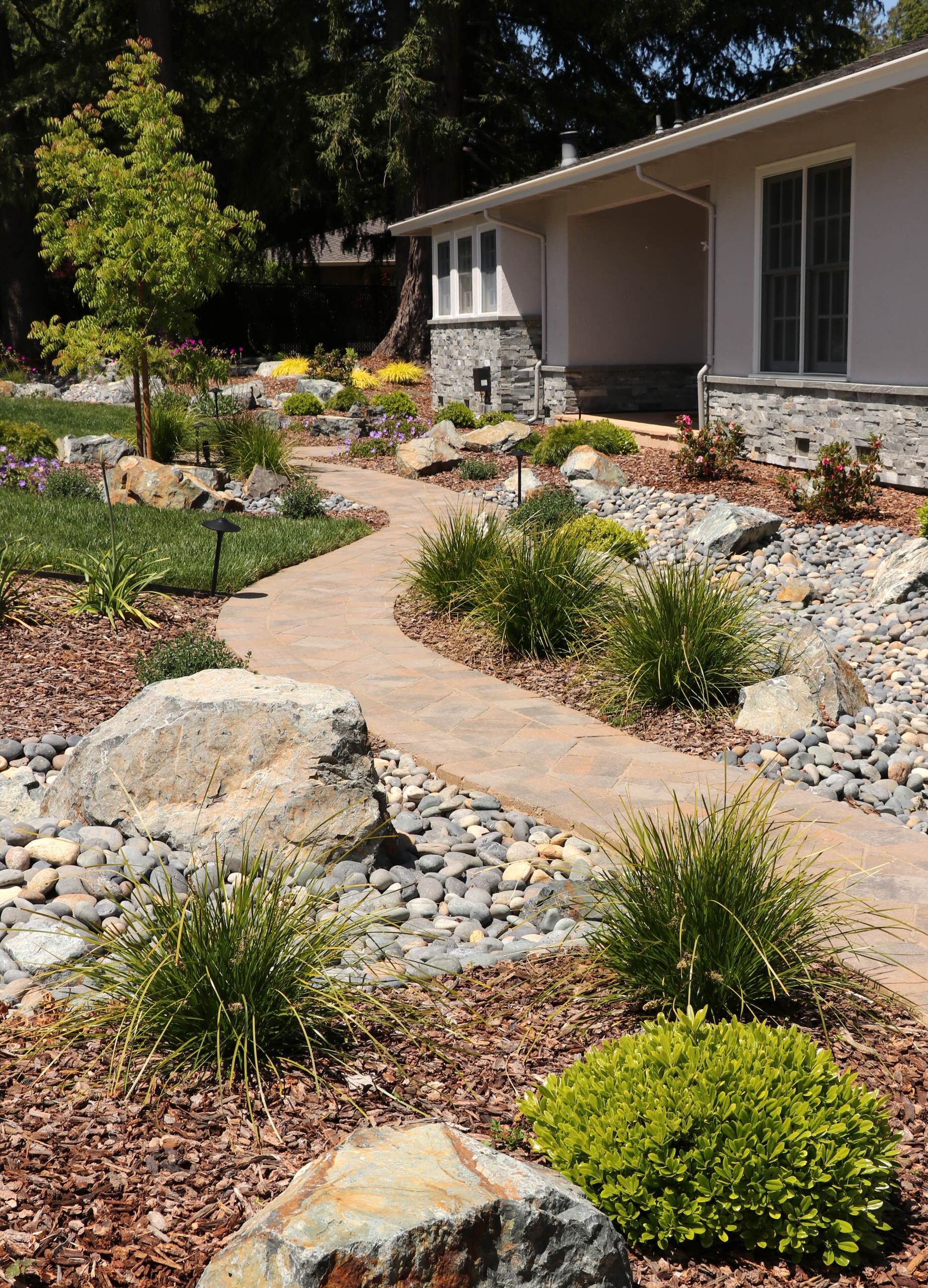FRONT YARD WITH TREES AND DRY-CREEK