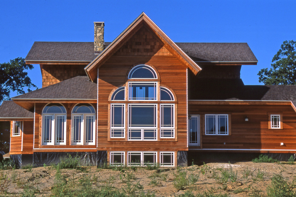 This is an example of a country two-storey exterior in Denver.