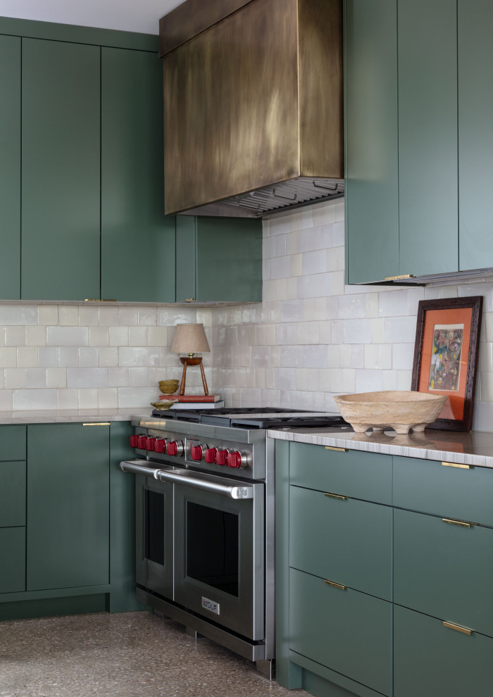 Martindale Water Ski Retreat - Example of a mid-sized trendy galley kitchen design in Austin with flat-panel cabinets, green cabinets, quartzite countertops, white backsplash, terra-cotta backsplash, stainless steel appliances, a peninsula and beige countertops