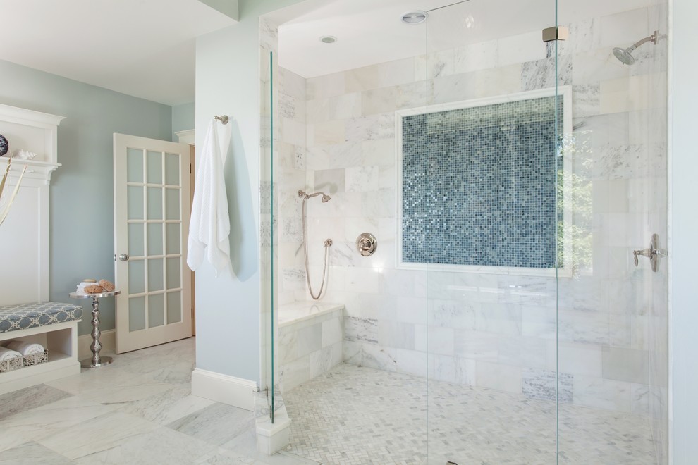 Beach style master bathroom in Boston with a corner shower, mosaic tile, blue walls, blue tile and white tile.