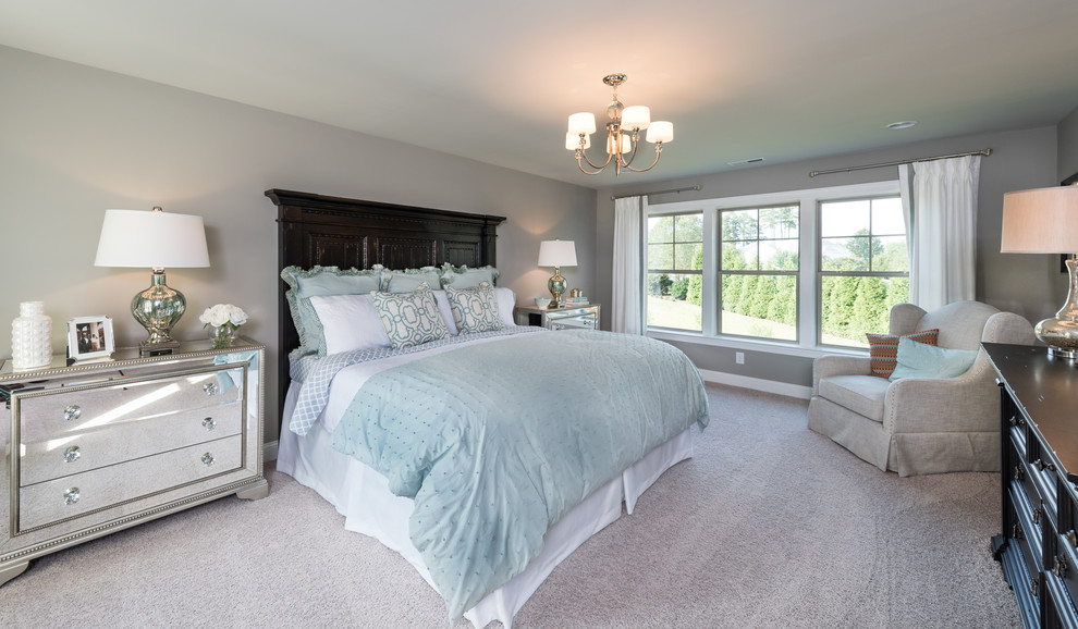 This is an example of a large transitional master bedroom in Raleigh with grey walls, carpet and no fireplace.