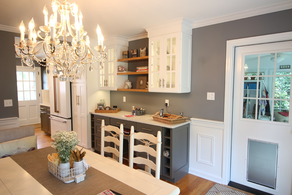 Inspiration for a mid-sized transitional u-shaped medium tone wood floor and brown floor enclosed kitchen remodel with a farmhouse sink, shaker cabinets, white cabinets, quartz countertops, white backsplash, subway tile backsplash, white appliances, no island and beige countertops