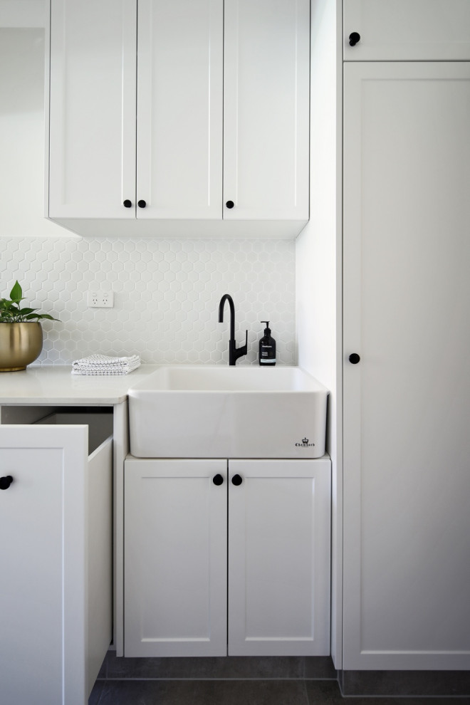 This is an example of a transitional laundry room in Perth.