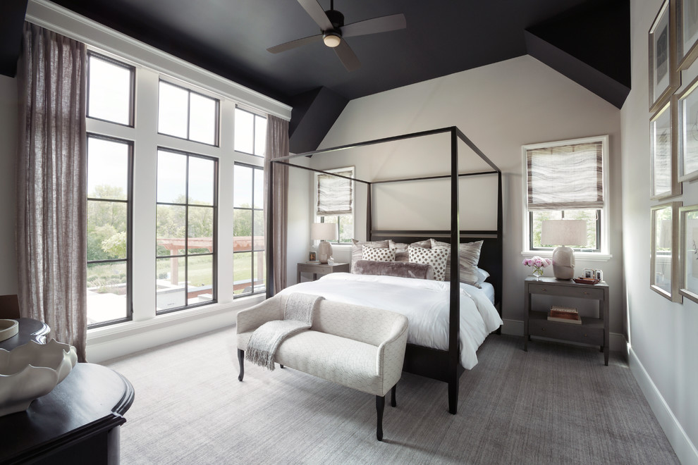 Inspiration for a large transitional master bedroom in Minneapolis with carpet, grey floor and grey walls.