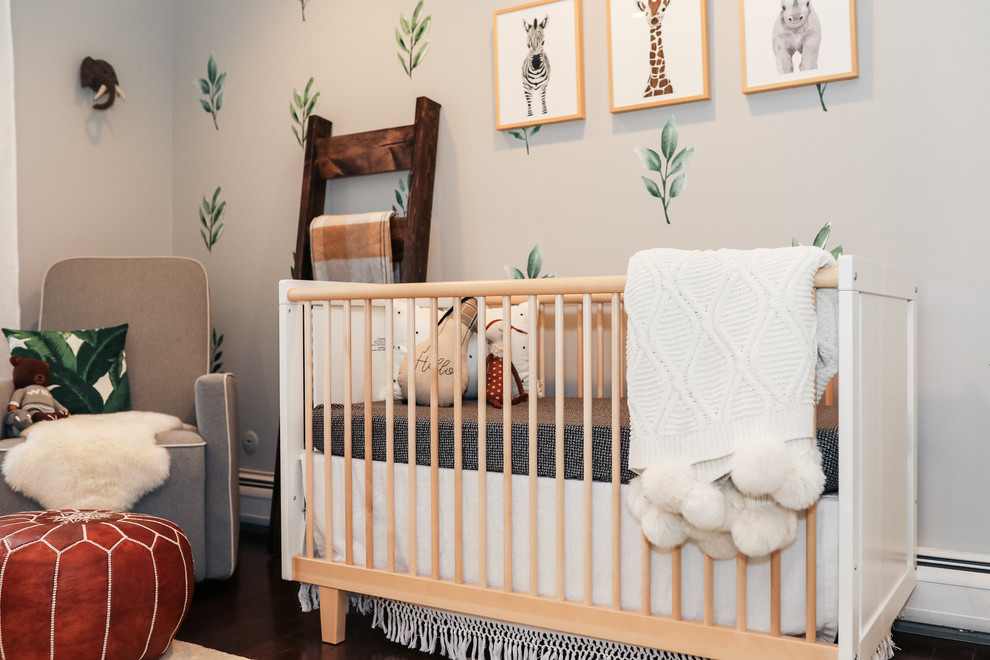 Example of a mid-sized country gender-neutral medium tone wood floor and brown floor nursery design in New York with gray walls