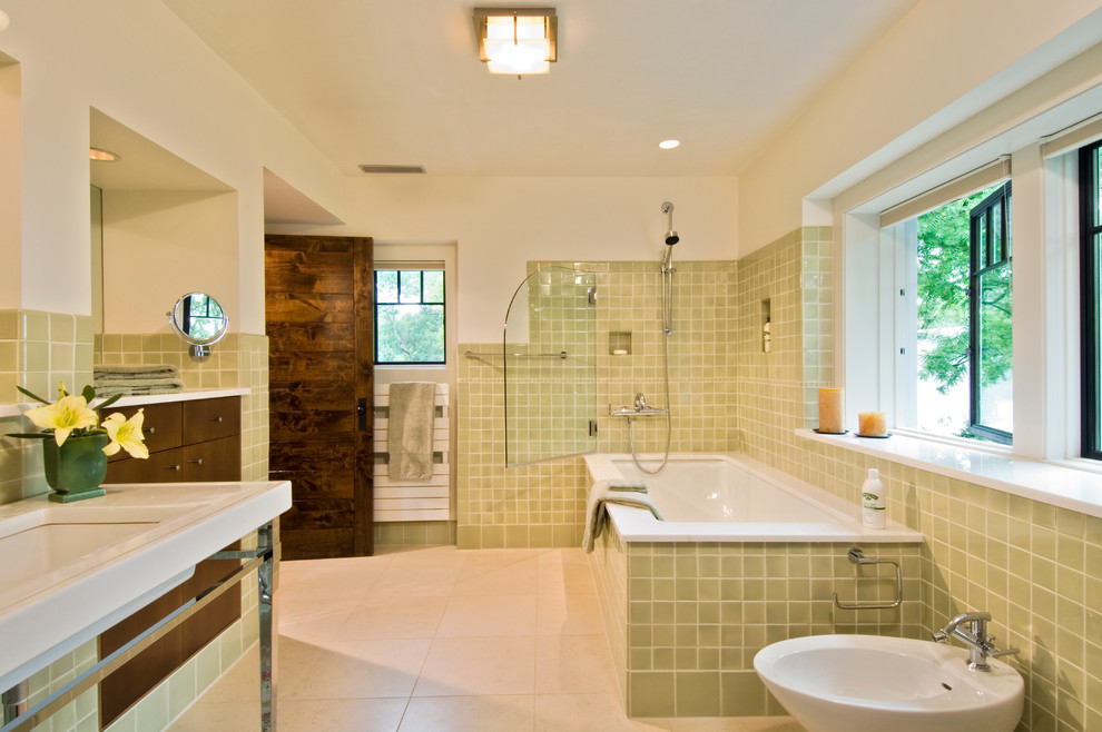 Large contemporary master bathroom in New York with a bidet, flat-panel cabinets, brown cabinets, green tile, beige walls, ceramic floors, a pedestal sink, marble benchtops, a corner tub, an open shower, ceramic tile, white floor and a hinged shower door.