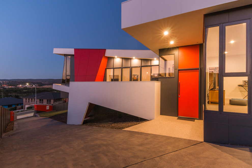 Large contemporary two-storey exterior in Hobart with concrete fiberboard siding and a flat roof.