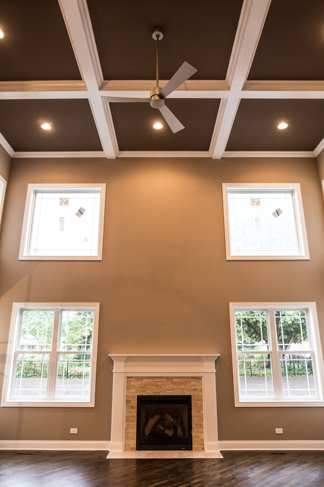 Home design - huge transitional formal and open concept dark wood floor home design idea in Chicago with brown walls, a standard fireplace, a stone fireplace and no tv