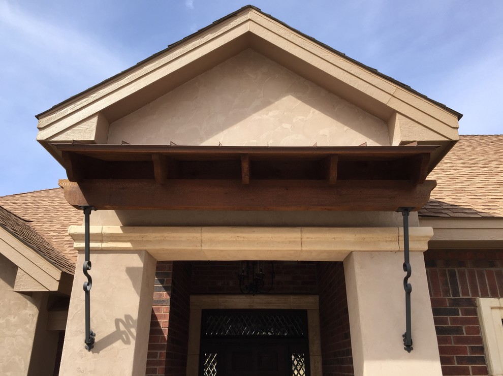 Mid-sized mountain style brick floor home design photo in Austin with beige walls and a dark wood front door