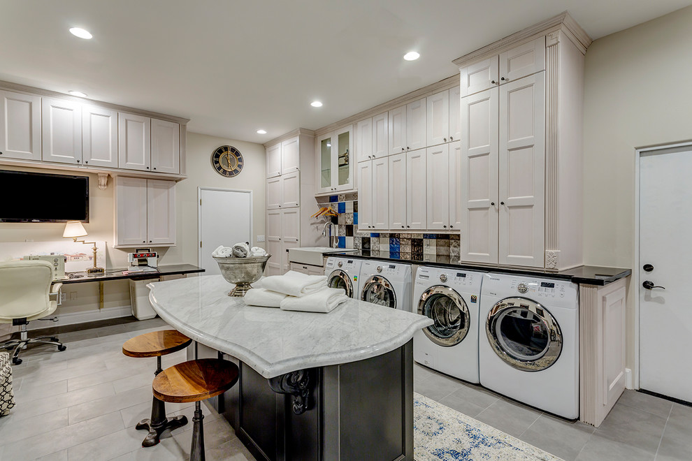 Photo of a traditional utility room in Phoenix with a farmhouse sink, recessed-panel cabinets, beige cabinets, beige walls, a side-by-side washer and dryer, grey floor and grey benchtop.