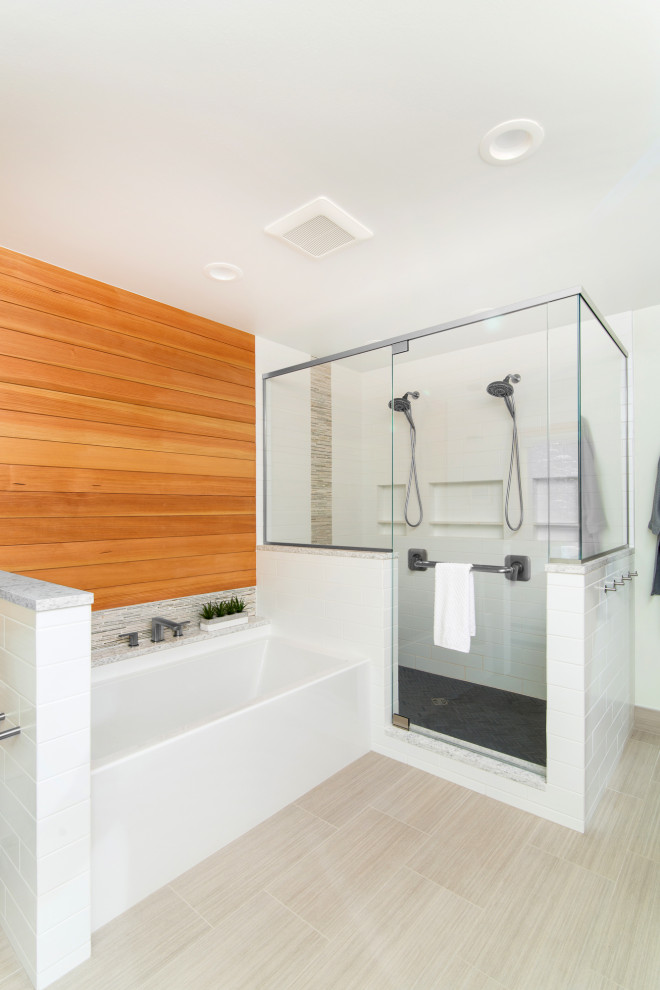 This is an example of a mid-sized contemporary master bathroom in Detroit with flat-panel cabinets, medium wood cabinets, an alcove tub, a double shower, a one-piece toilet, white tile, porcelain tile, white walls, porcelain floors, an undermount sink, engineered quartz benchtops, beige floor, a hinged shower door and white benchtops.