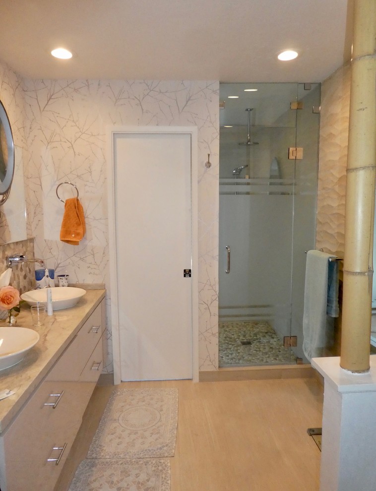 Alcove shower - mid-sized transitional master porcelain tile and beige floor alcove shower idea with flat-panel cabinets, beige cabinets, beige walls, a vessel sink, quartzite countertops, a hinged shower door and beige countertops
