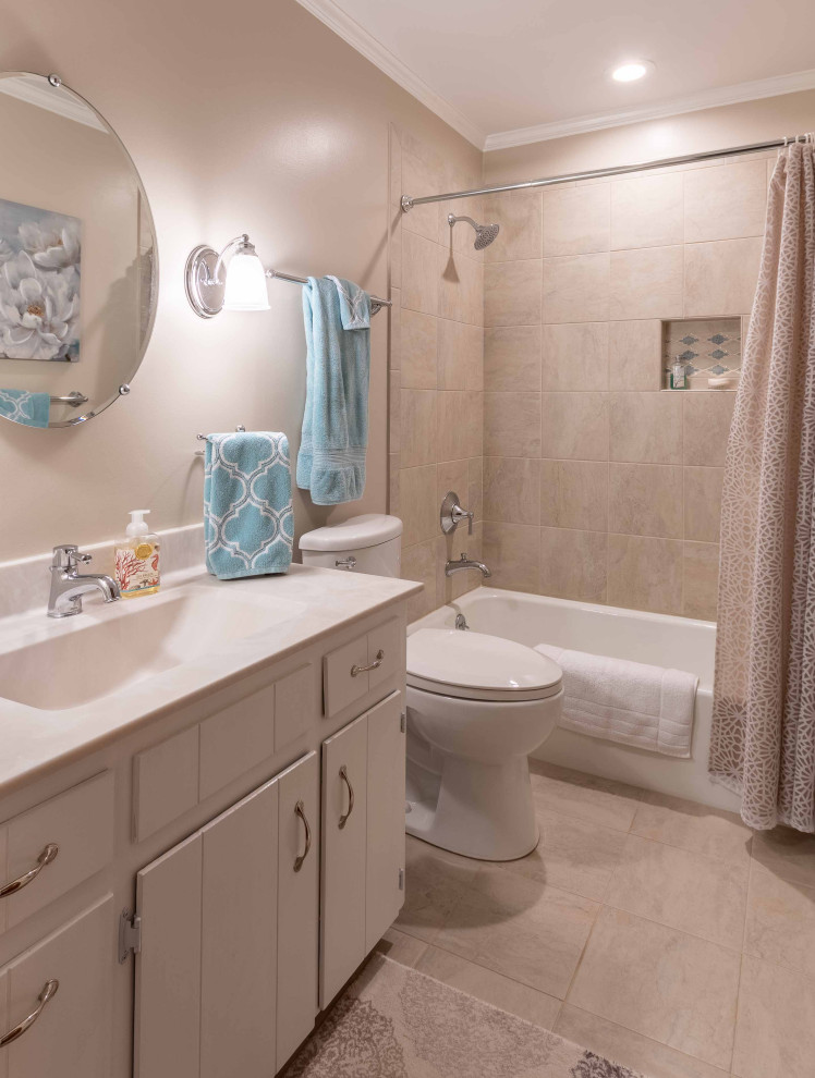 Bathroom - small transitional kids' beige tile and ceramic tile ceramic tile, beige floor and single-sink bathroom idea in Other with beaded inset cabinets, white cabinets, a one-piece toilet, beige walls, an integrated sink, solid surface countertops, multicolored countertops, a niche and a built-in vanity