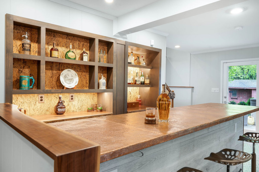 This is an example of a mid-sized country galley home bar in Columbus with shaker cabinets, medium wood cabinets, copper benchtops, beige splashback, ceramic floors, multi-coloured floor and brown benchtop.