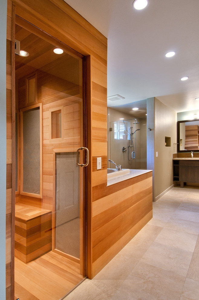 Design ideas for an asian master bathroom in Seattle with flat-panel cabinets, a japanese tub, beige walls and beige floor.