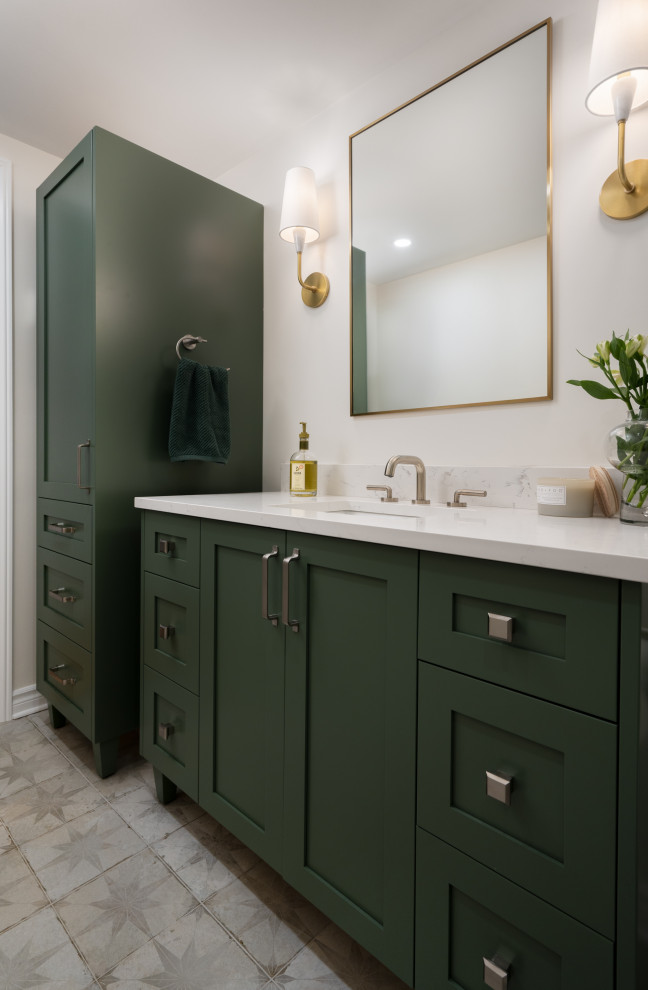 Small modern kids bathroom in Montreal with shaker cabinets, green cabinets, an alcove tub, an alcove shower, a one-piece toilet, white tile, ceramic tile, white walls, mosaic tile floors, an undermount sink, engineered quartz benchtops, beige floor, a sliding shower screen, white benchtops, a single vanity and a freestanding vanity.