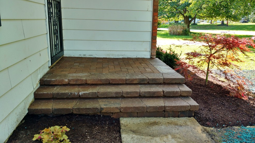 This is an example of a small transitional front yard brick landscaping in Chicago.