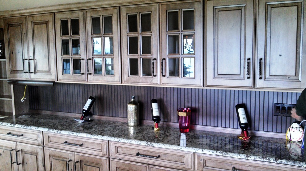 Example of a mountain style kitchen design in Seattle with granite countertops