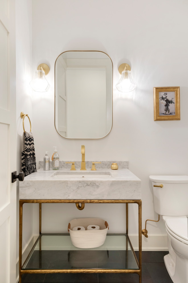 This is an example of a mid-sized powder room in Minneapolis with a two-piece toilet, white walls, ceramic floors, an undermount sink, marble benchtops, black floor and multi-coloured benchtops.