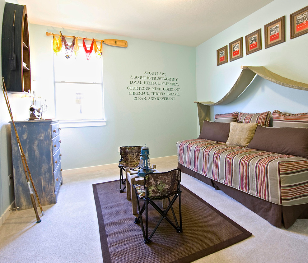 Design ideas for a country kids' bedroom for boys in Austin with blue walls and carpet.