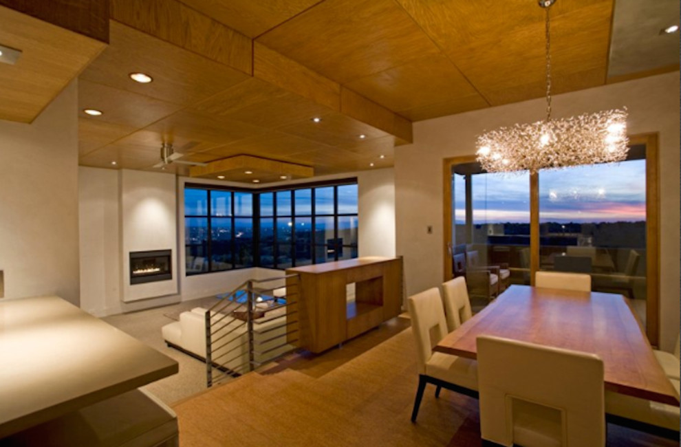 This is an example of a mid-sized contemporary dining room in Albuquerque with grey walls and cork floors.
