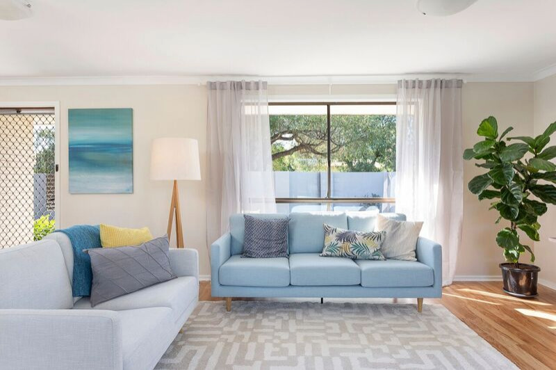 Mid-sized beach style enclosed light wood floor living room photo in Perth