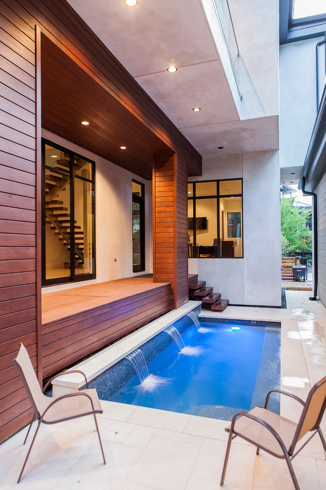 This is an example of a mid-sized contemporary pool in Houston.