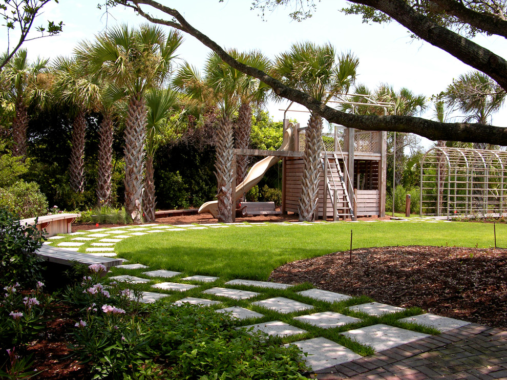Design ideas for a large contemporary backyard full sun garden in Charleston with with outdoor playset and concrete pavers.