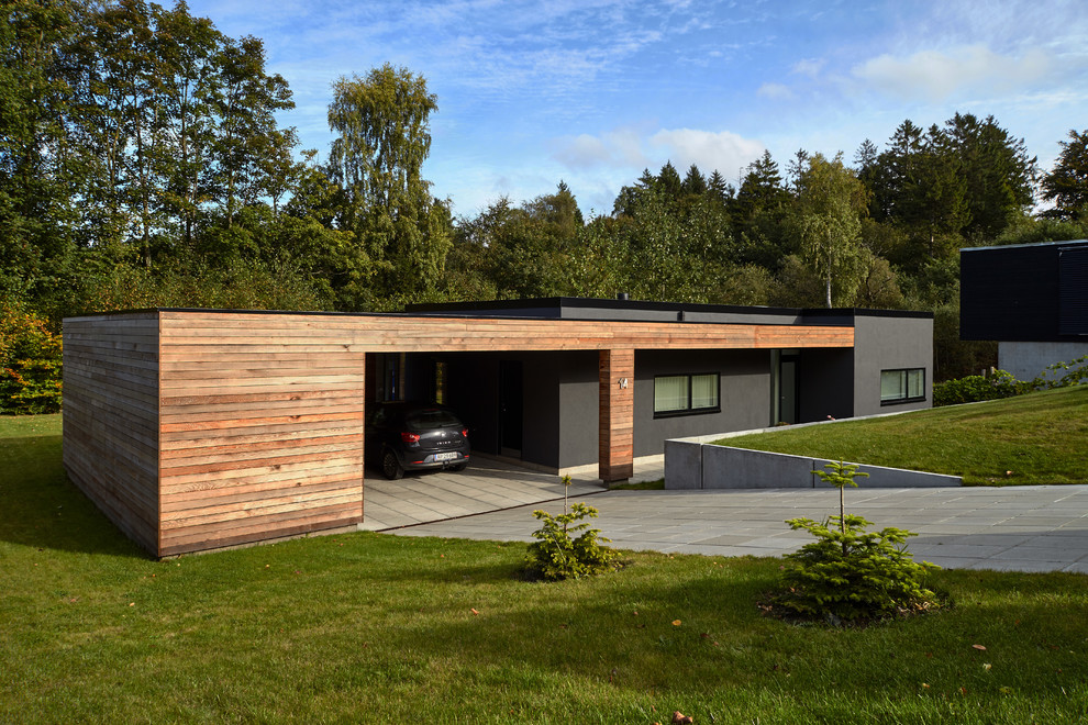 Photo of a mid-sized modern detached two-car garage in Aalborg.