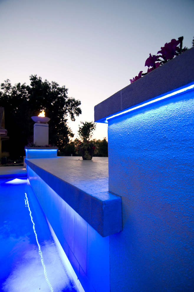 Example of a large transitional backyard concrete paver and rectangular natural hot tub design in Cedar Rapids