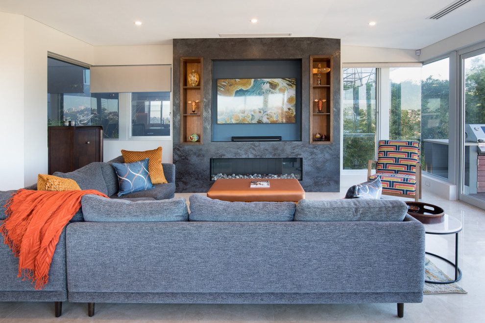 Modern open concept living room in Sydney with a standard fireplace, a tile fireplace surround and a built-in media wall.