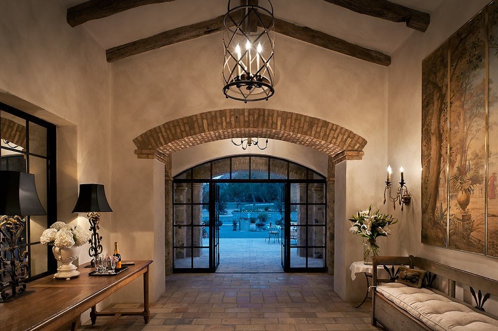 This is an example of a large entryway in Phoenix with beige walls, a double front door and a glass front door.