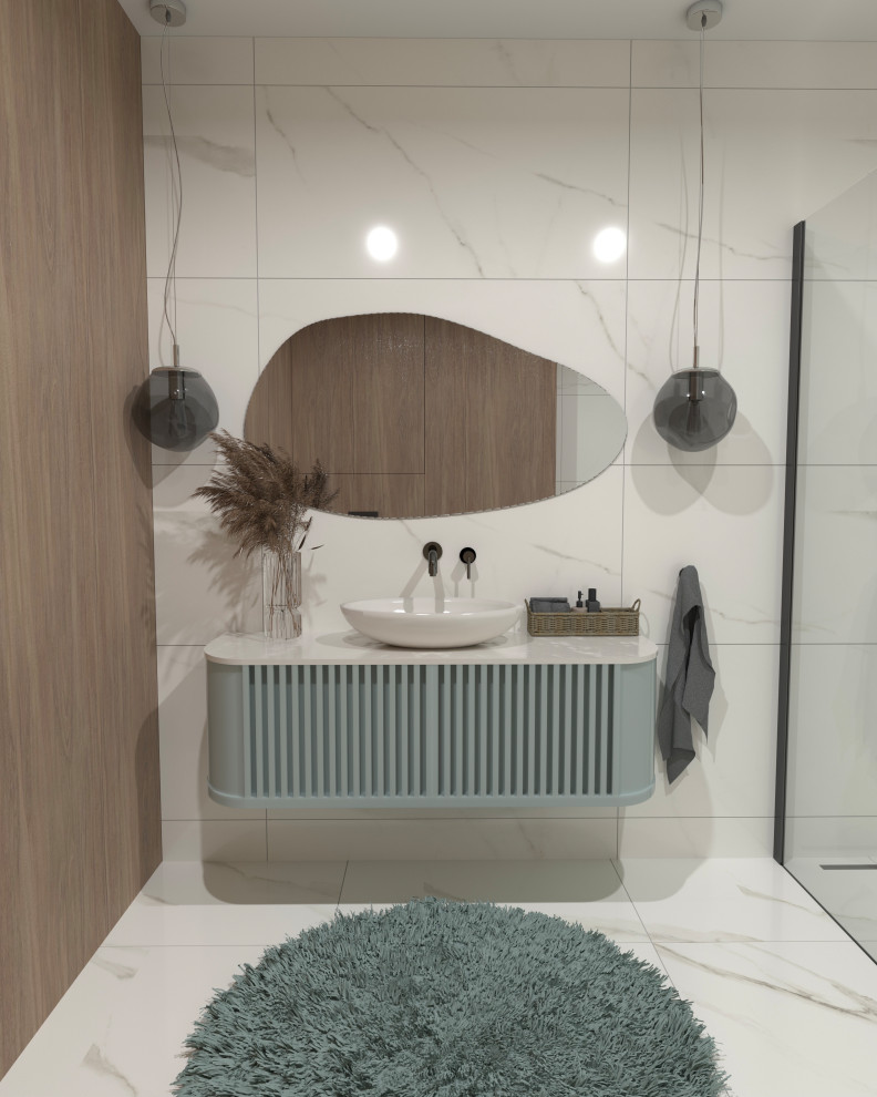 This is an example of a mid-sized modern kids bathroom in London with shaker cabinets, blue cabinets, an open shower, a wall-mount toilet, white tile, ceramic tile, white walls, marble floors, a vessel sink, quartzite benchtops, white floor, white benchtops, a single vanity and a floating vanity.