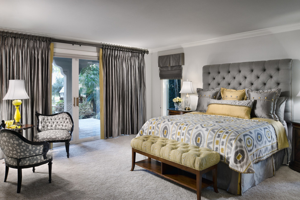 This is an example of a contemporary bedroom in San Diego with grey walls, carpet, no fireplace and grey floor.
