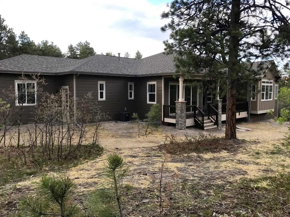 Inspiration for a large transitional brown one-story mixed siding house exterior remodel in Denver with a hip roof and a shingle roof