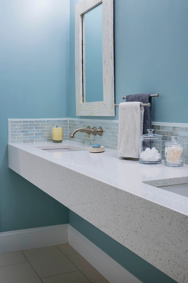 Inspiration for a mid-sized modern master bathroom in Boston with a wall-mount sink and recycled glass benchtops.