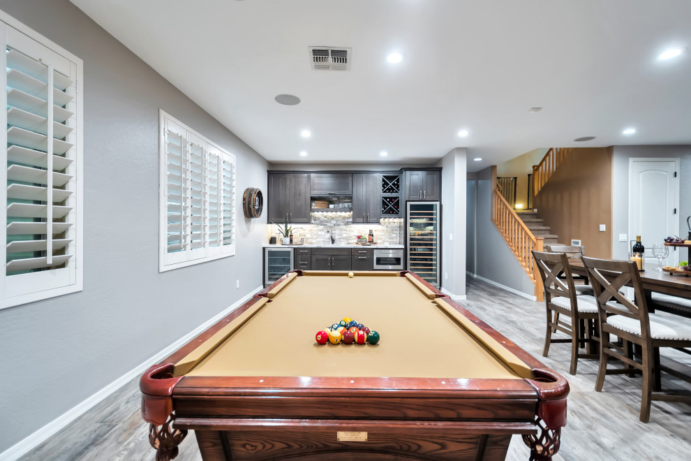 Basement - large transitional porcelain tile and multicolored floor basement idea in Phoenix