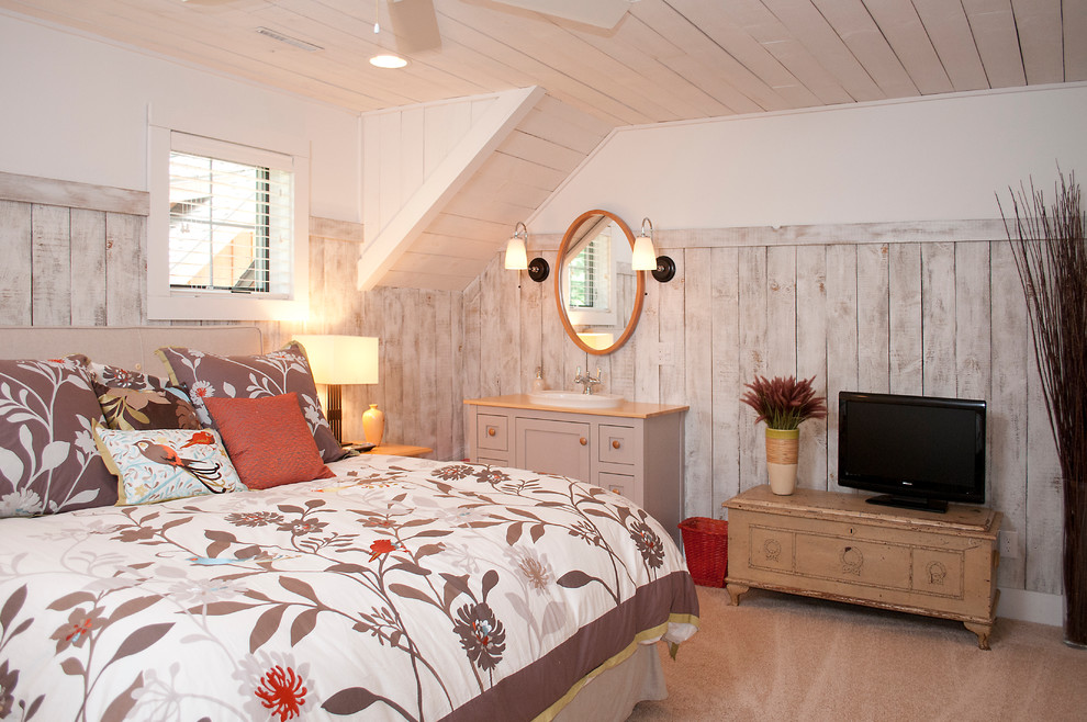 This is an example of a mid-sized country master bedroom in Other with multi-coloured walls, carpet and no fireplace.