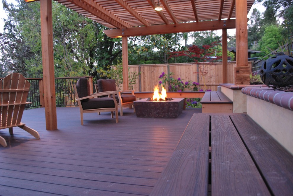 Inspiration for a large mediterranean deck in San Francisco with a fire feature and a pergola.