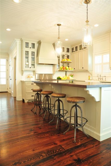 Design ideas for a mid-sized country l-shaped open plan kitchen in Atlanta with an undermount sink, recessed-panel cabinets, white cabinets, dark hardwood floors, with island and brown floor.