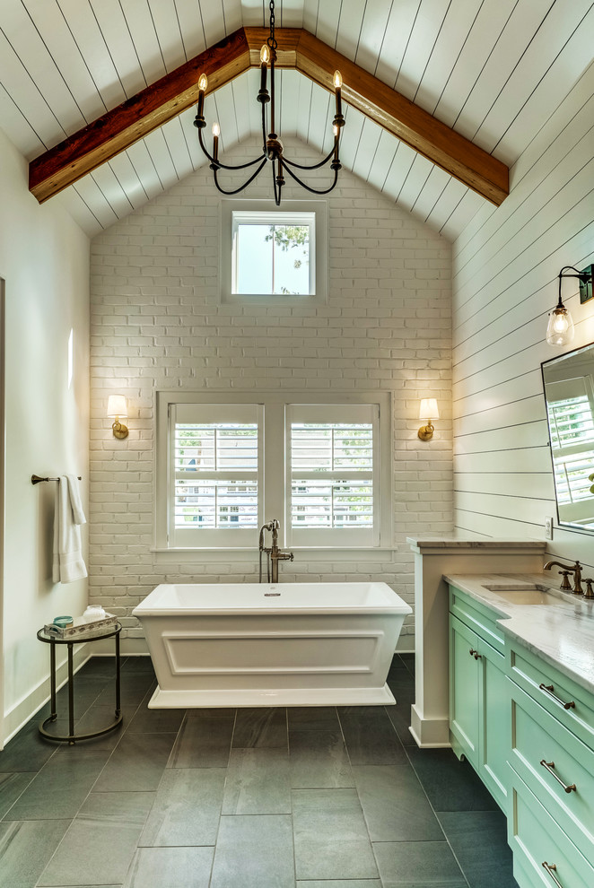 Design ideas for an expansive country master bathroom in Richmond with shaker cabinets, turquoise cabinets, a freestanding tub, white walls, ceramic floors, an undermount sink and grey floor.